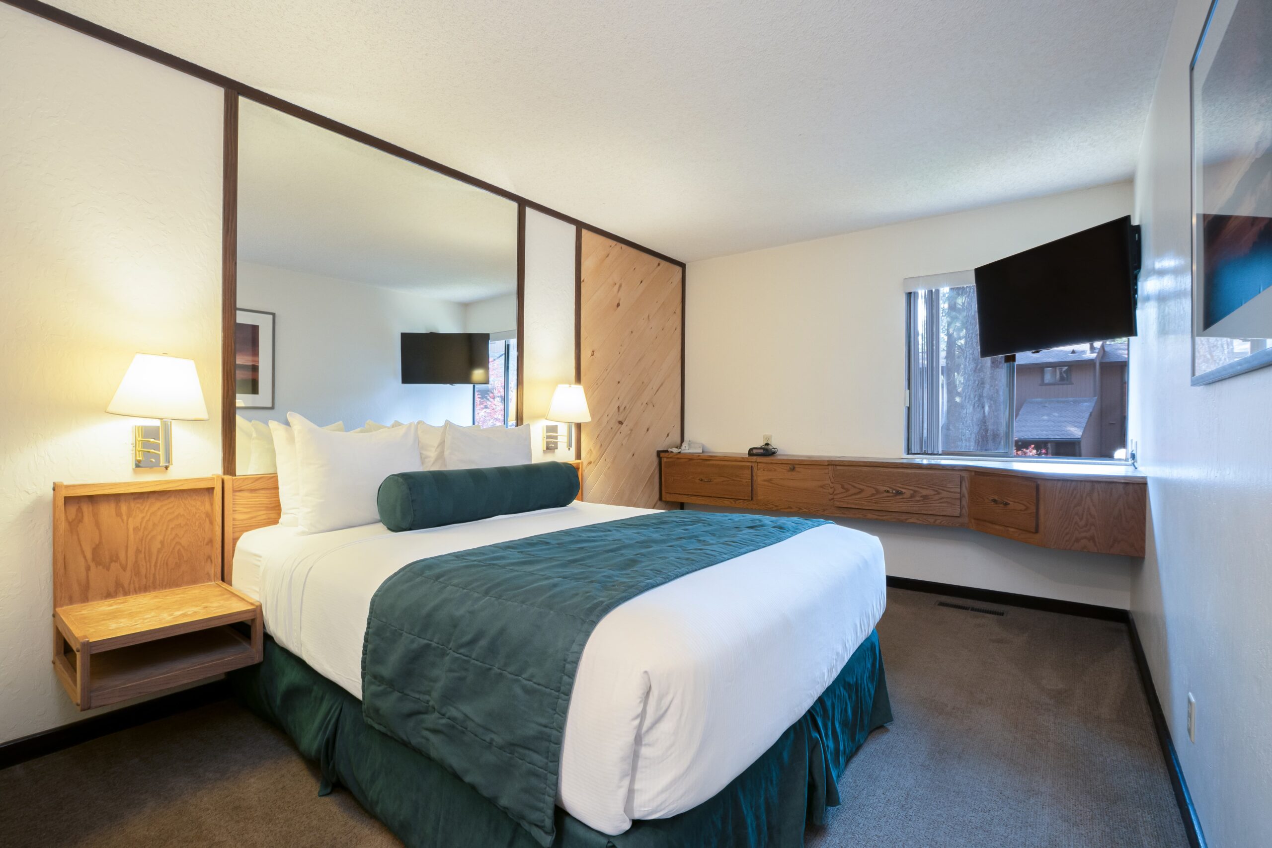 Bed in front of mirror